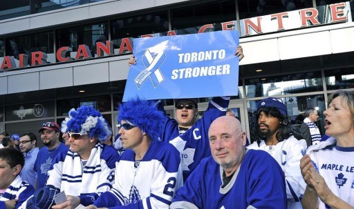 Maple Leaf fan holds up Toronto Stronger sign to mock Boston