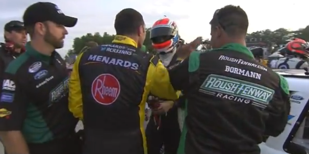 Max Papis slaps Billy Johnson on helmet after Nationwide Series race at Road America