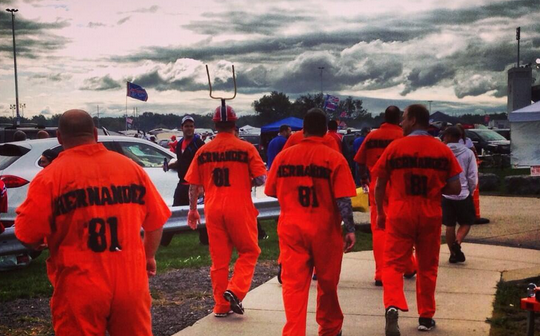 Bills fans show up in orange jumpsuits with Hernandez 81