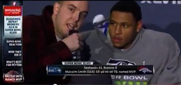How did 9/11 Conspiracy Theorist sneak into Malcolm Smith’s Super Bowl Press Conference?
