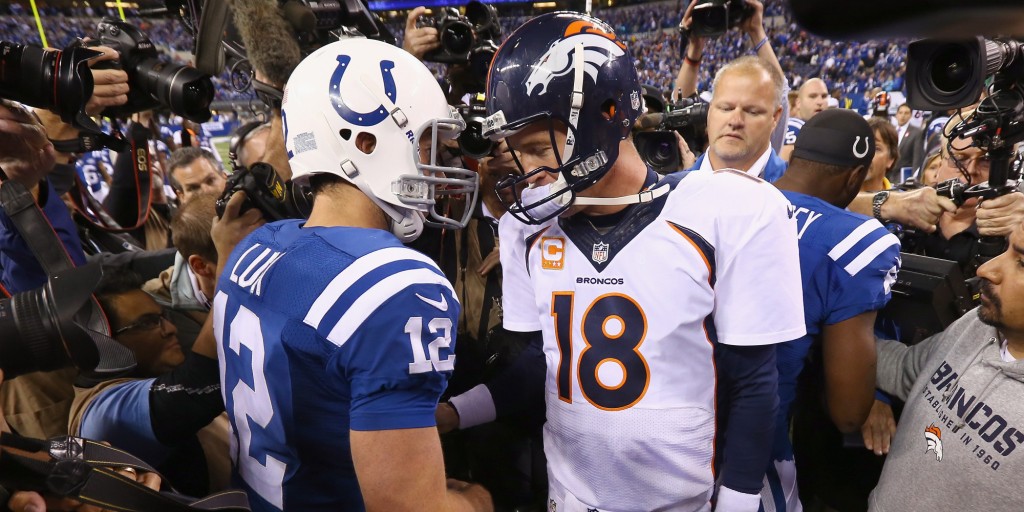 INDIANAPOLIS, IN - OCTOBER 20:  Andrew Luck #12 of the Indianapolis Colts and Peyton Manning #18 of the Denver Broncos meet after the game at Lucas Oil Stadium on October 20, 2013 in Indianapolis, Indiana. The Colts won 39-33. (Photo by Andy Lyons/Getty Images)