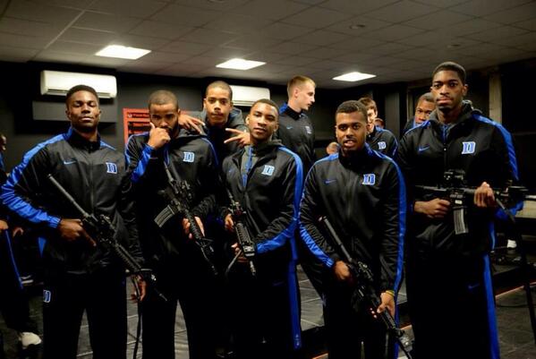 Duke Basketball team enjoys gun simulation, takes photos with rifles