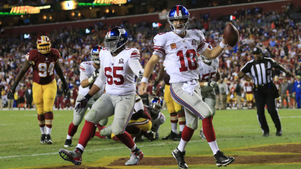 LANDOVER, MD - SEPTEMBER 25: Quarterback Eli Manning #10 of the New York Giants celebrates his 4th quarter touchdown against the Washington Redskins at FedExField on September 25, 2014 in Landover, Maryland. (Photo by Rob Carr/Getty Images)